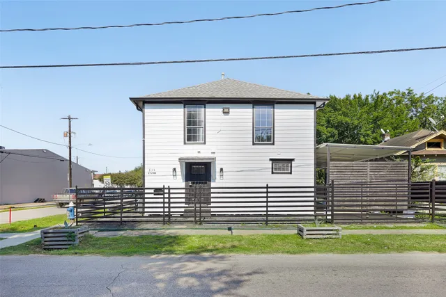 a view of a house with a small garden