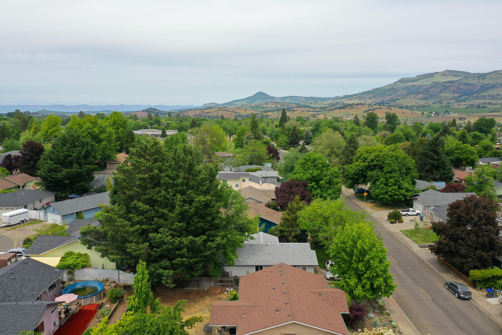 537 Bell Road Talent, OR 97540 - Photo 23 of 23 an aerial view of a city with lots of residential buildings ocean and mountain view in back
