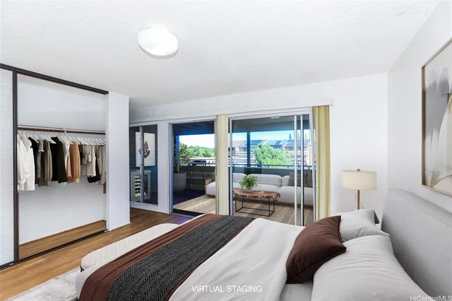 a bedroom with a bed and glass door