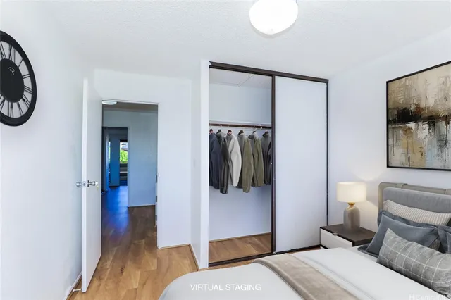 a bedroom with a bed and a mirror