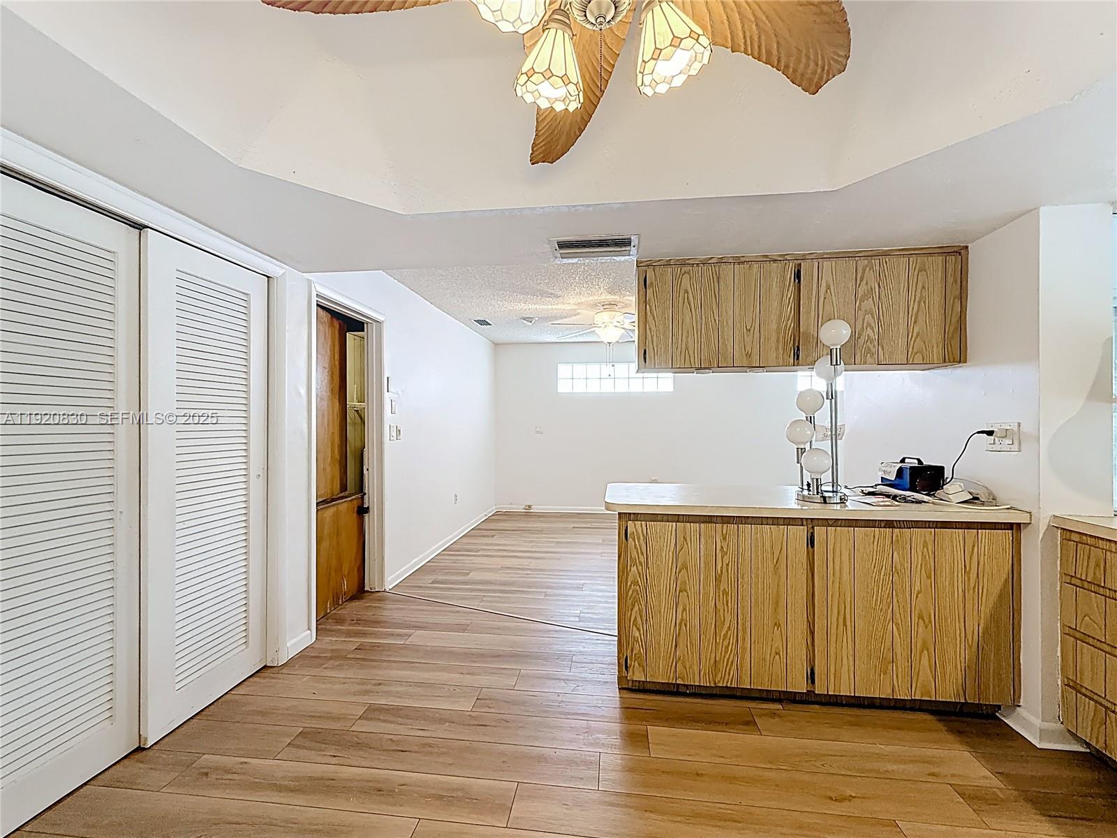 7541 Embassy Boulevard Miramar, FL 33023 - Photo 14 of 60 a view of a kitchen with wooden floor and a sink