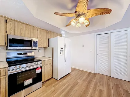 a bathroom with a granite countertop toilet sink and shower