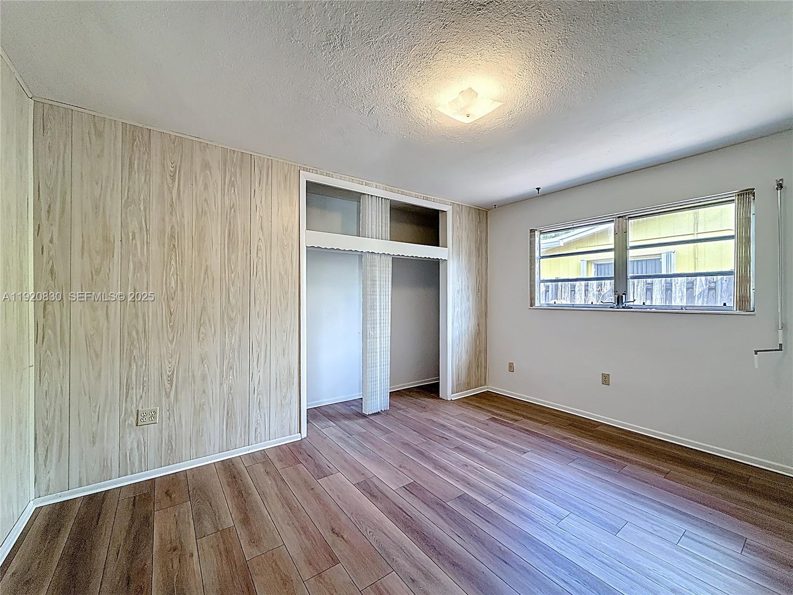 7541 Embassy Boulevard Miramar, FL 33023 - Photo 35 of 60 an empty room with wooden floor and windows