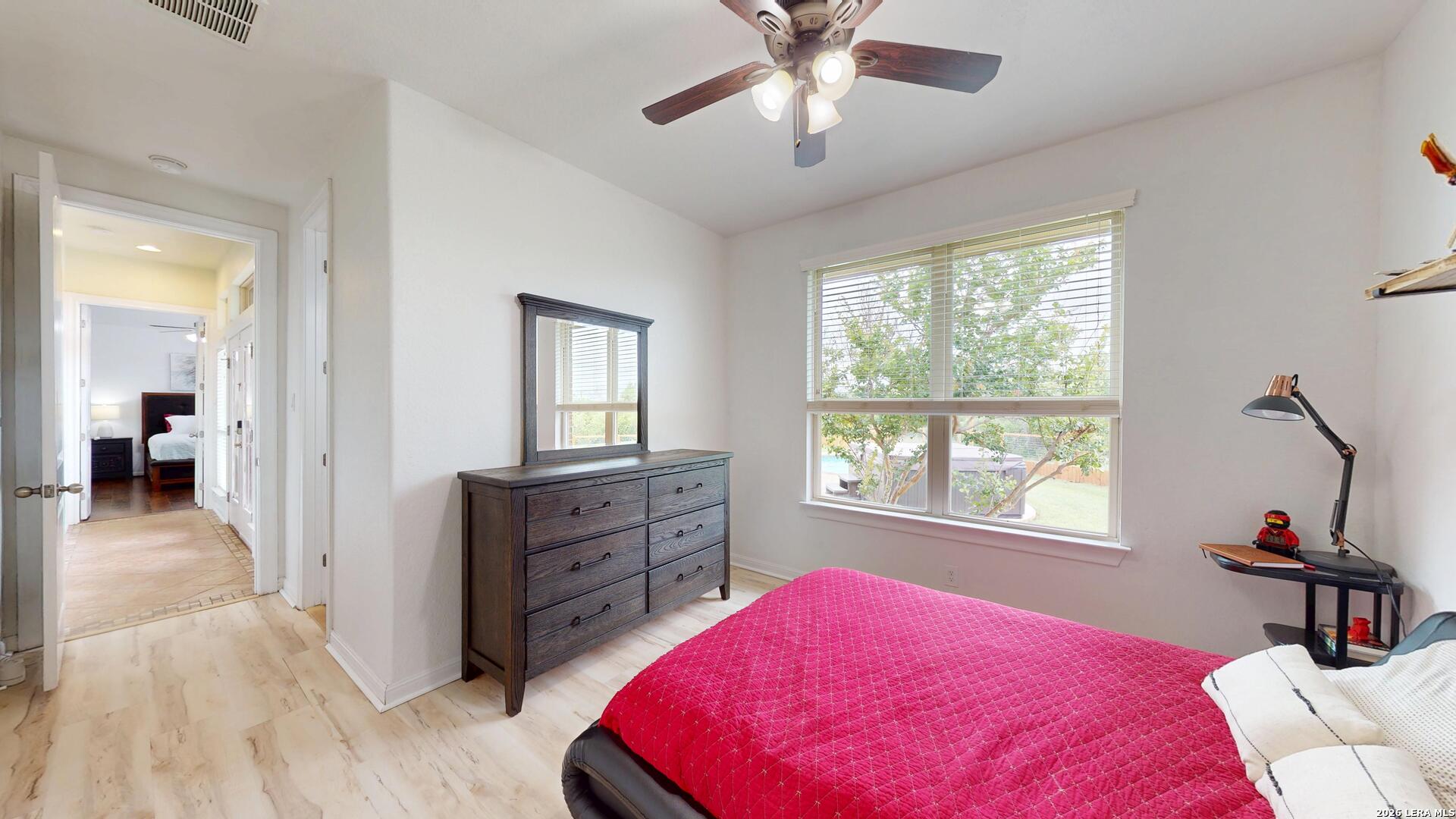 10111 Shallow Bank Converse, TX 78109 - Photo 40 of 65 a bed room with a bed and a dresser