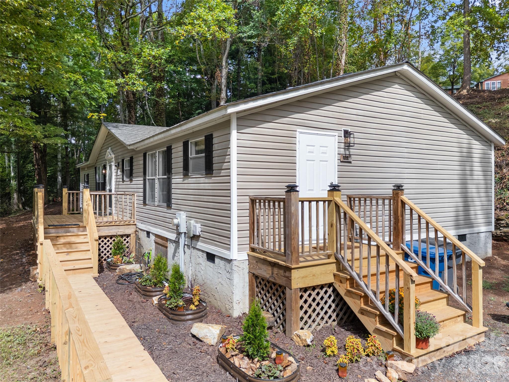 25 Overbrook Drive Saluda, NC 28773 - Photo 2 of 42 a view of a house with a porch