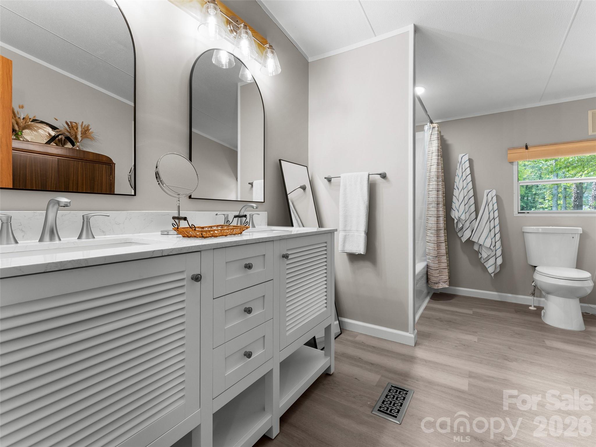 25 Overbrook Drive Saluda, NC 28773 - Photo 23 of 42 a bathroom with a double vanity sink mirror and toilet