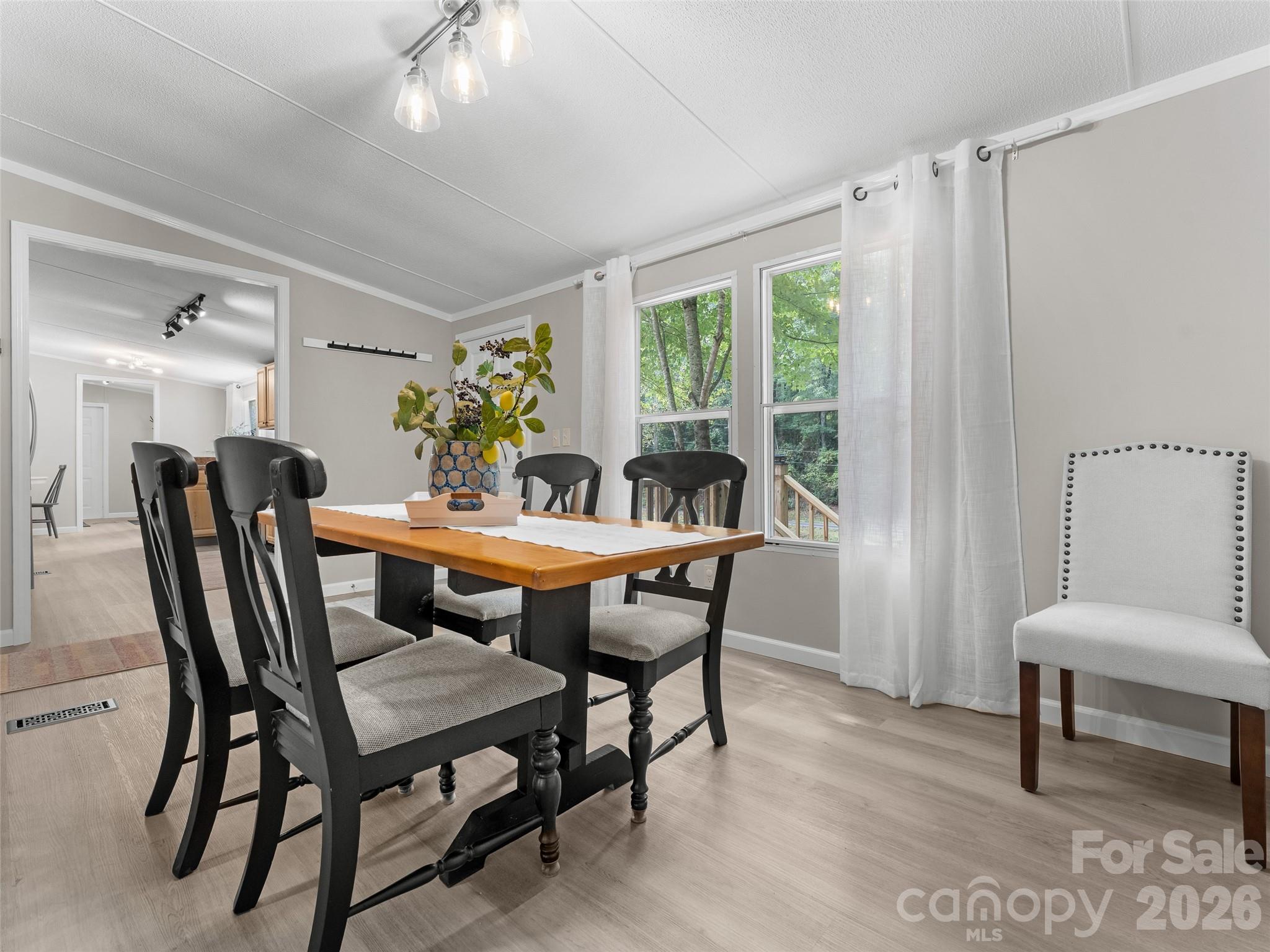 25 Overbrook Drive Saluda, NC 28773 - Photo 27 of 42 a view of a dining room with furniture and a window