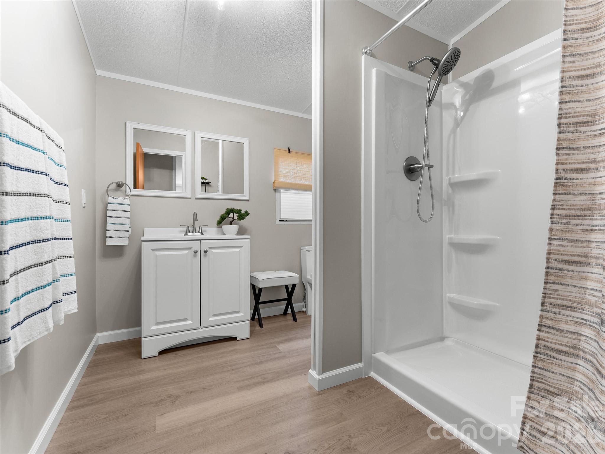 25 Overbrook Drive Saluda, NC 28773 - Photo 33 of 42 a bathroom with a sink toilet and shower