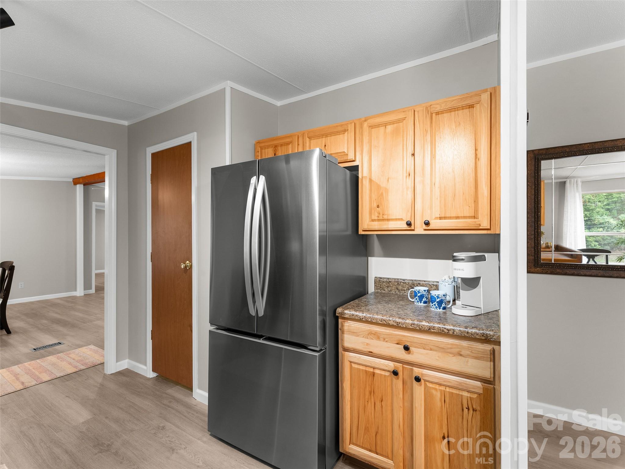 25 Overbrook Drive Saluda, NC 28773 - Photo 35 of 42 a kitchen with stainless steel appliances a refrigerator sink and cabinets