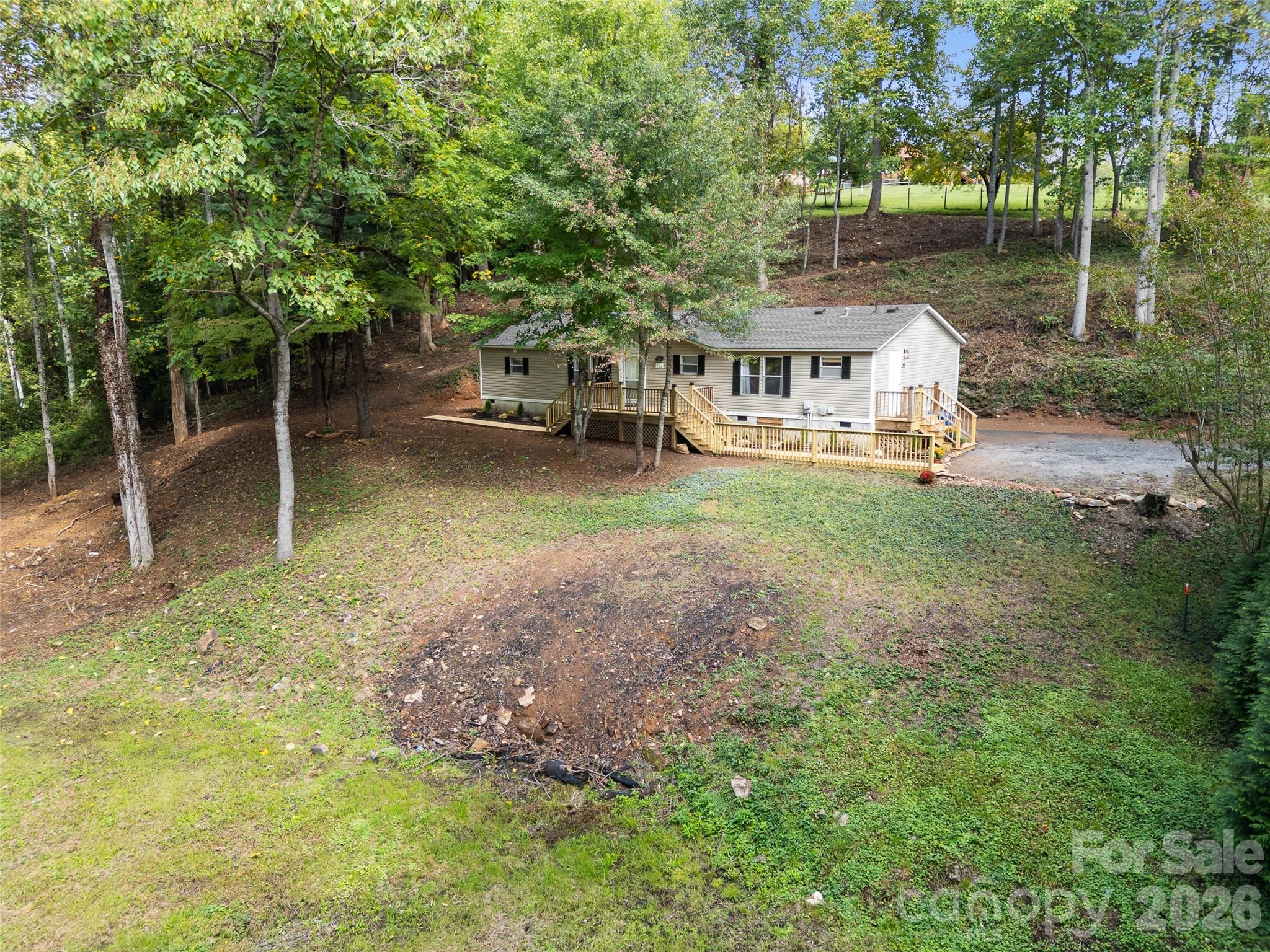 25 Overbrook Drive Saluda, NC 28773 - Photo 38 of 42 a view of a house with backyard and sitting area