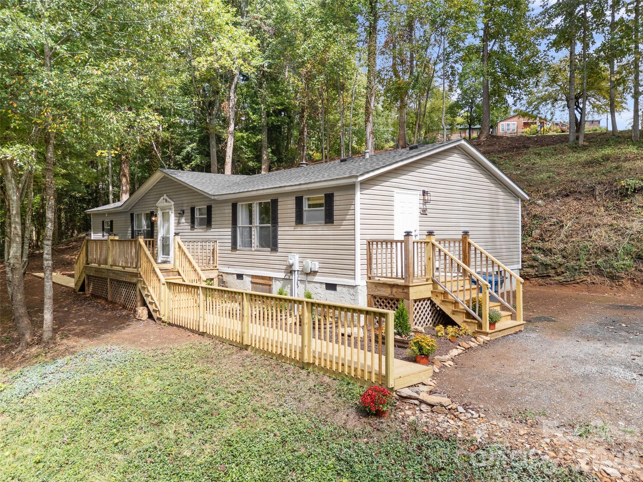 25 Overbrook Drive Saluda, NC 28773 - Photo 6 of 42 a view of a house with a yard and wooden fence