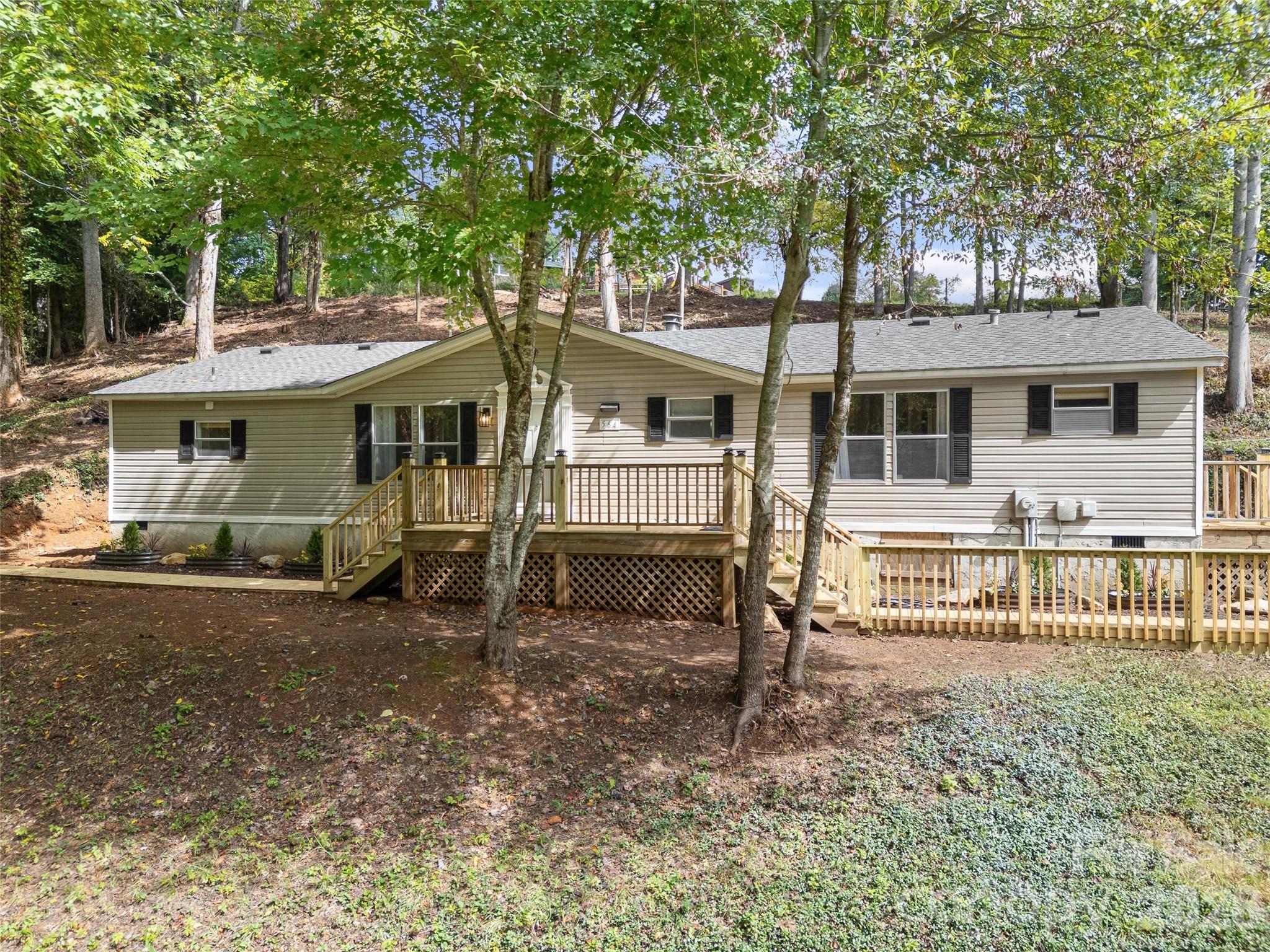 25 Overbrook Drive Saluda, NC 28773 - Photo 7 of 42 a view of a house with a yard and sitting area