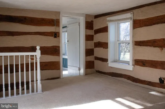 a view of an empty room with a window