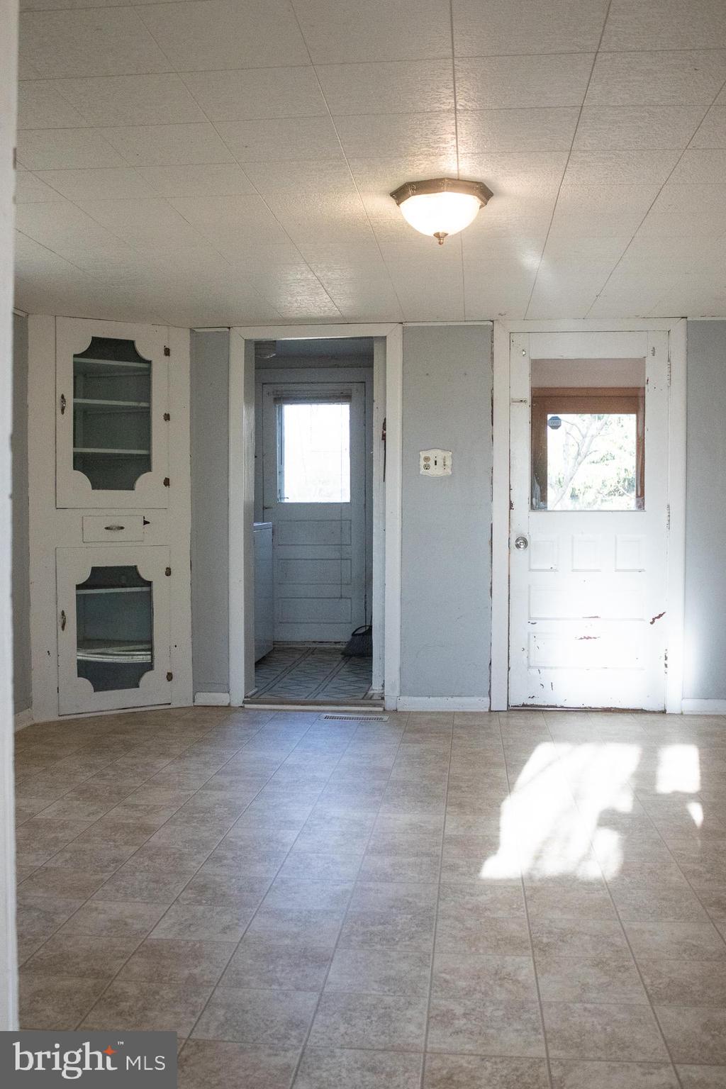 1624 Baust Church Road Union Bridge, MD 21791 - Photo 15 of 19 an empty room with windows and fireplace