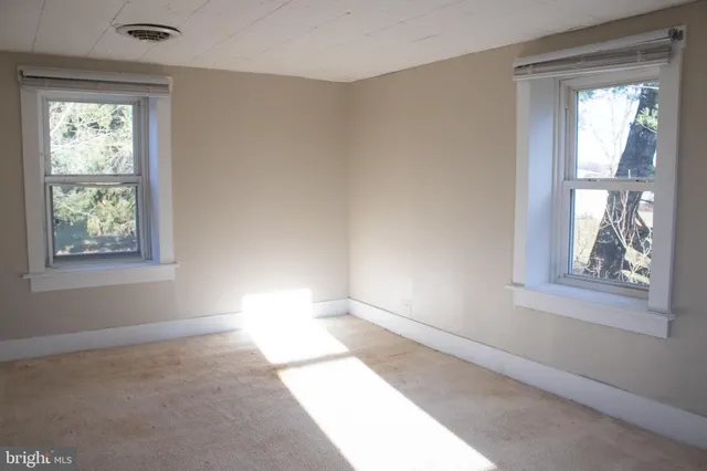a view of empty room with windows