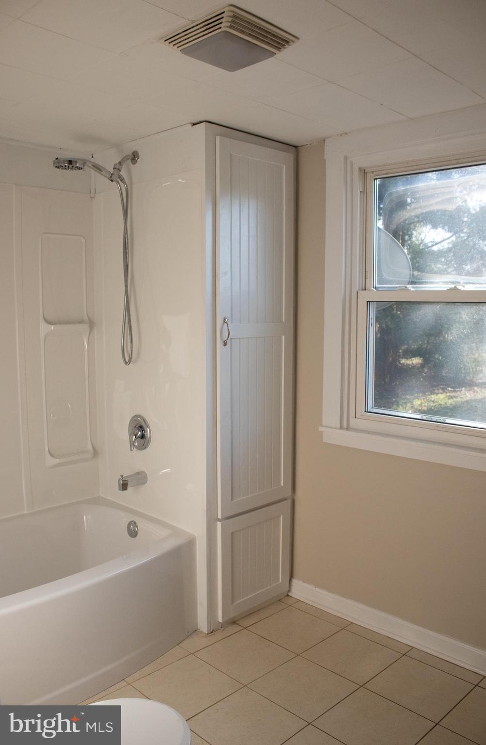 1624 Baust Church Road Union Bridge, MD 21791 - Photo 19 of 19 a bathroom with a bathtub and a shower