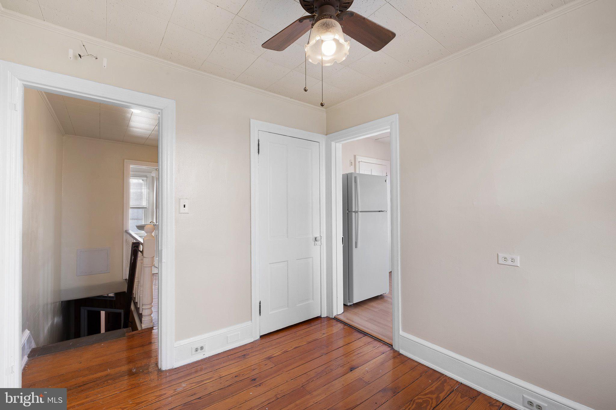 221 Chestnut Street New Castle, DE 19720 - Photo 15 of 25 a view of an empty room with wooden floor