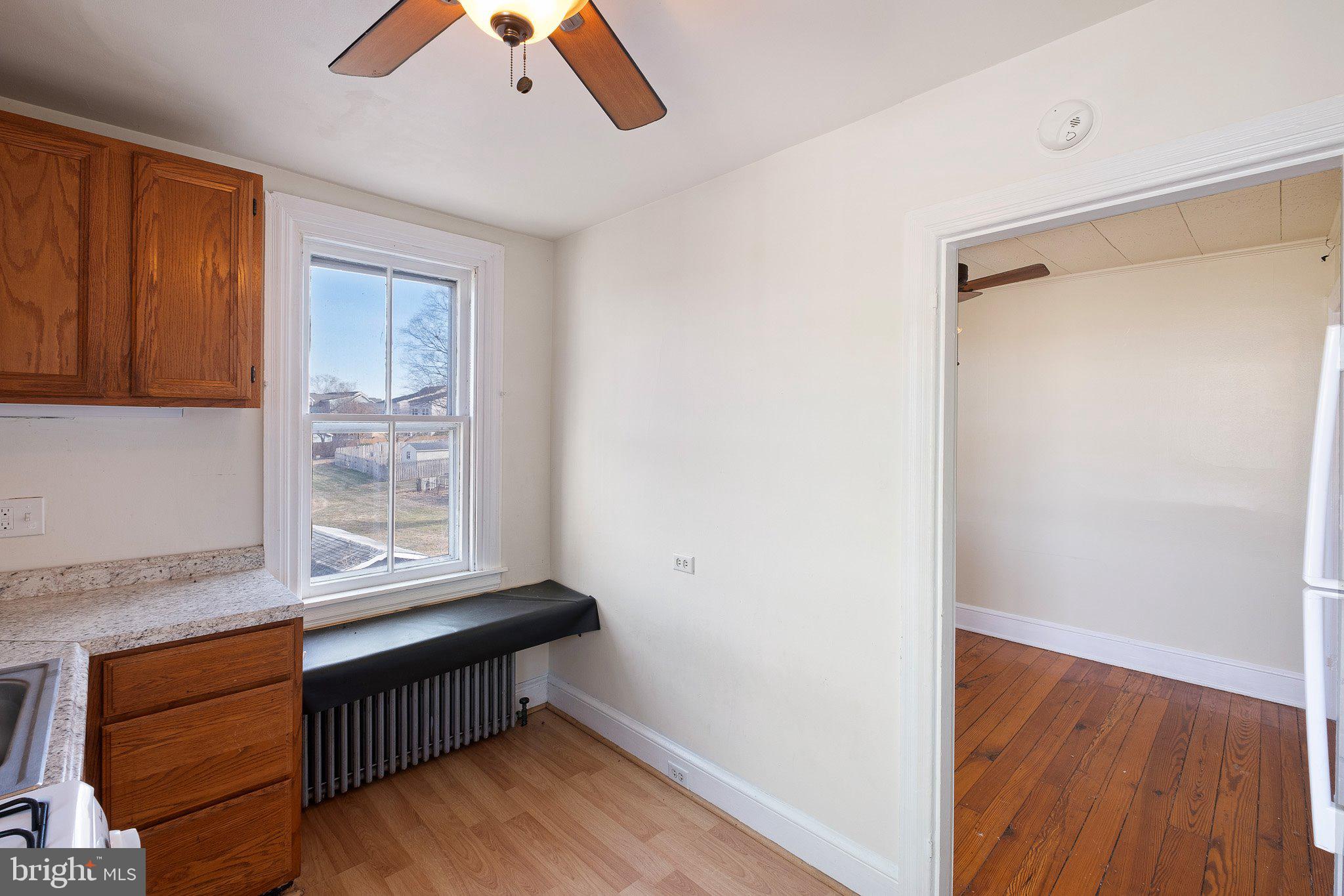 221 Chestnut Street New Castle, DE 19720 - Photo 18 of 25 a room with wooden floor and window