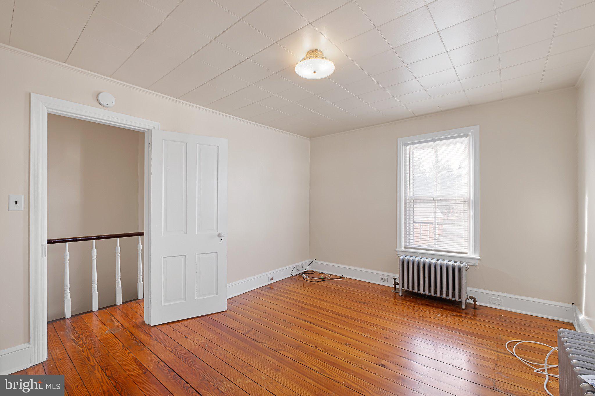 221 Chestnut Street New Castle, DE 19720 - Photo 20 of 25 a view of empty room with wooden floor and fan