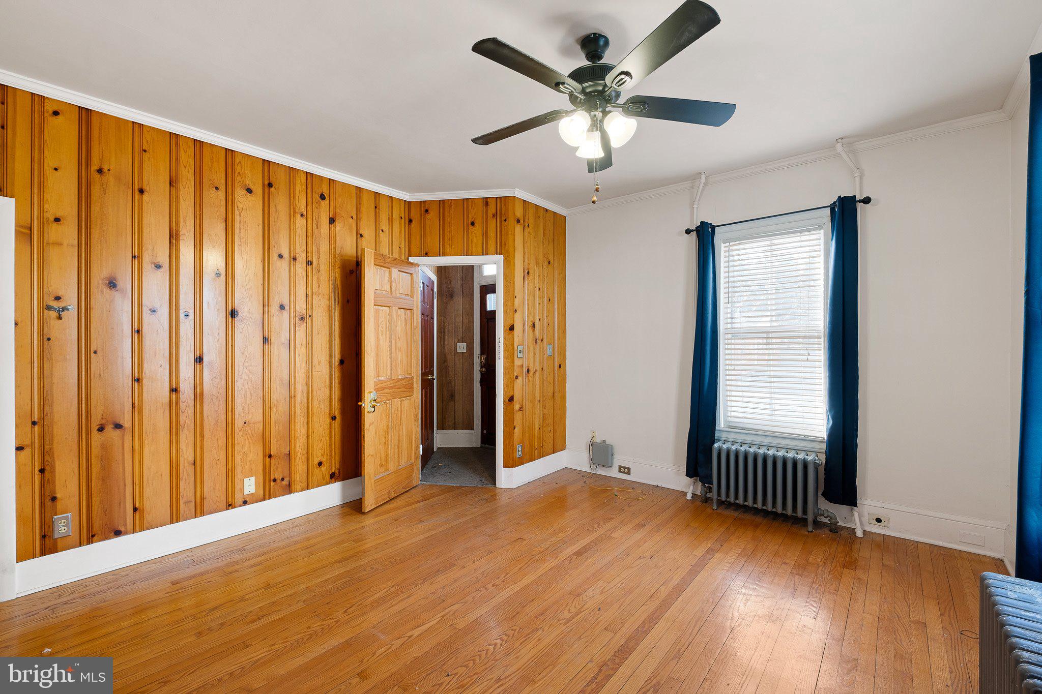 221 Chestnut Street New Castle, DE 19720 - Photo 3 of 25 wooden floor in an empty room with a window