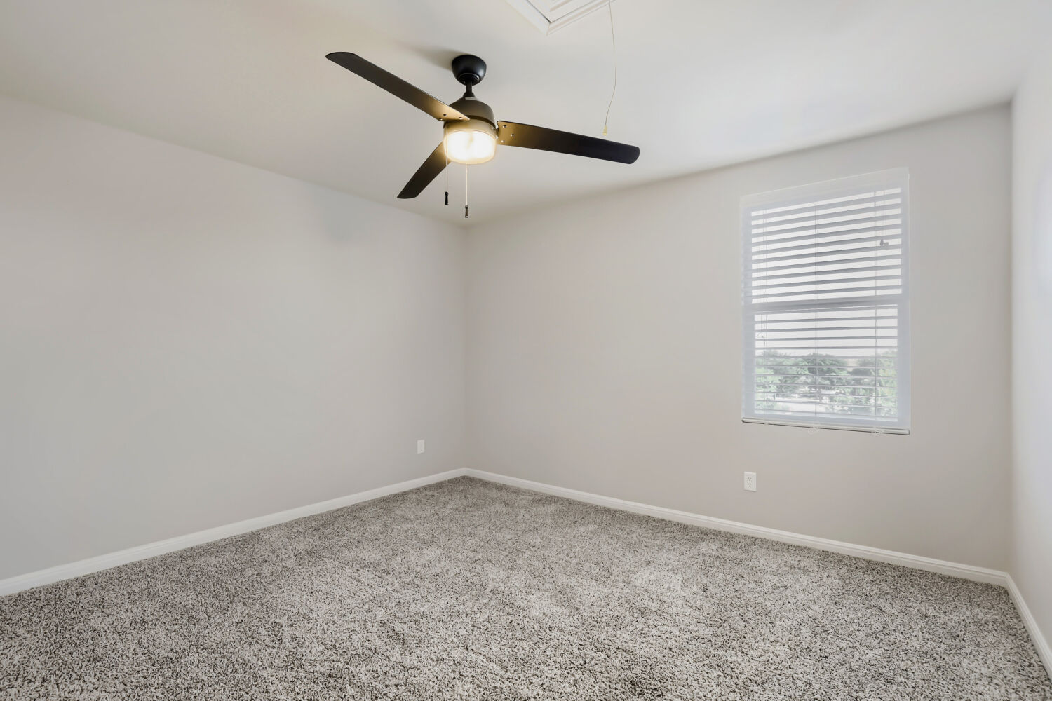5136 Hellman Kyle, TX 78640 - Photo 20 of 25 an empty room with a window and a ceiling fan