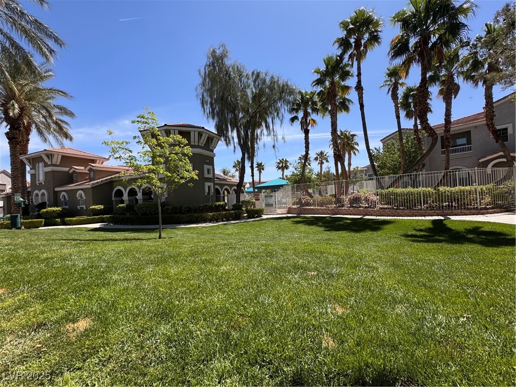 9975 Peace Way, Unit 1140 Las Vegas, NV 89147 - Photo 20 of 23 View of yard featuring fence