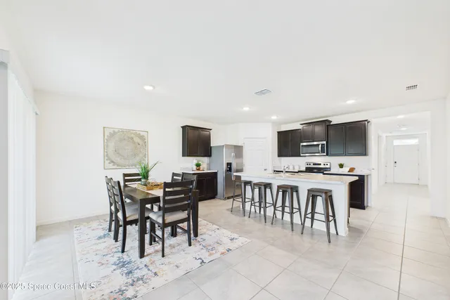 a living room with furniture a rug and a window