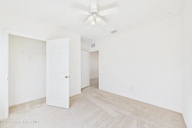 a bathroom with a double vanity sink a mirror and a shower