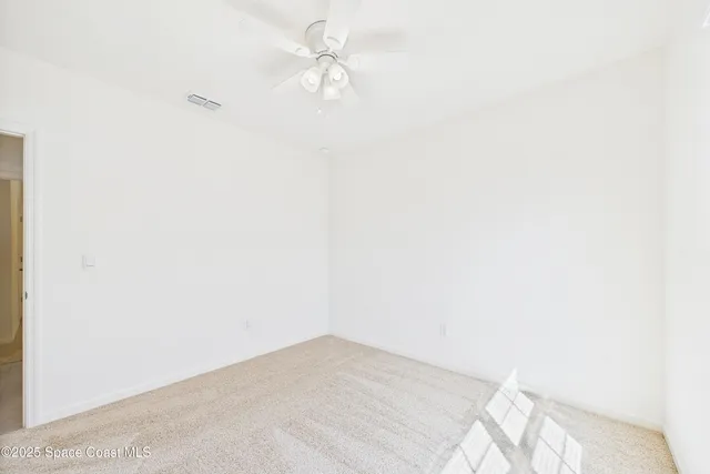 a bathroom with a granite countertop sink a mirror and a