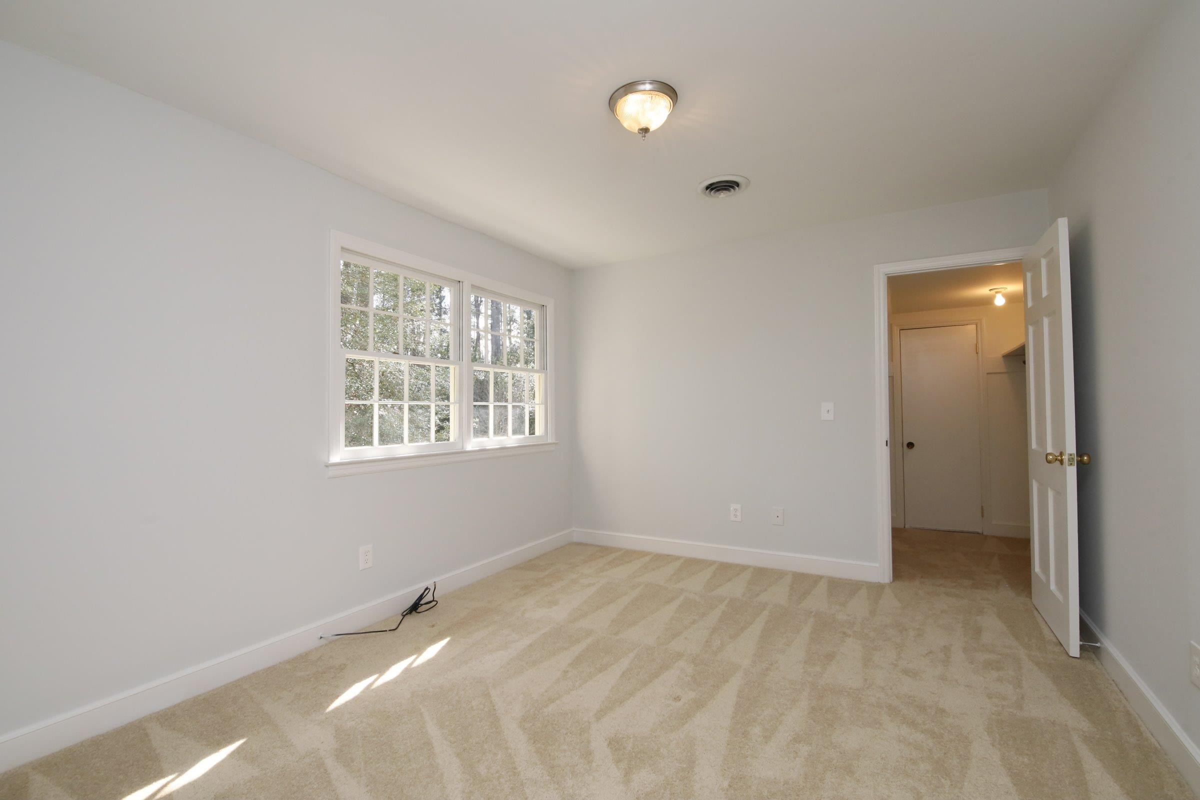 2509 Alpine Road Durham, NC 27707 - Photo 34 of 36 Walk in closet has access to attic storage. 4th Bedroom