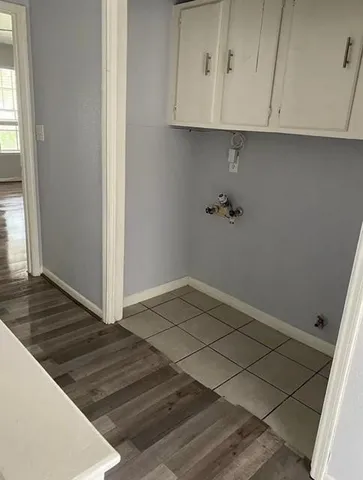 a view of an empty room and wooden floor