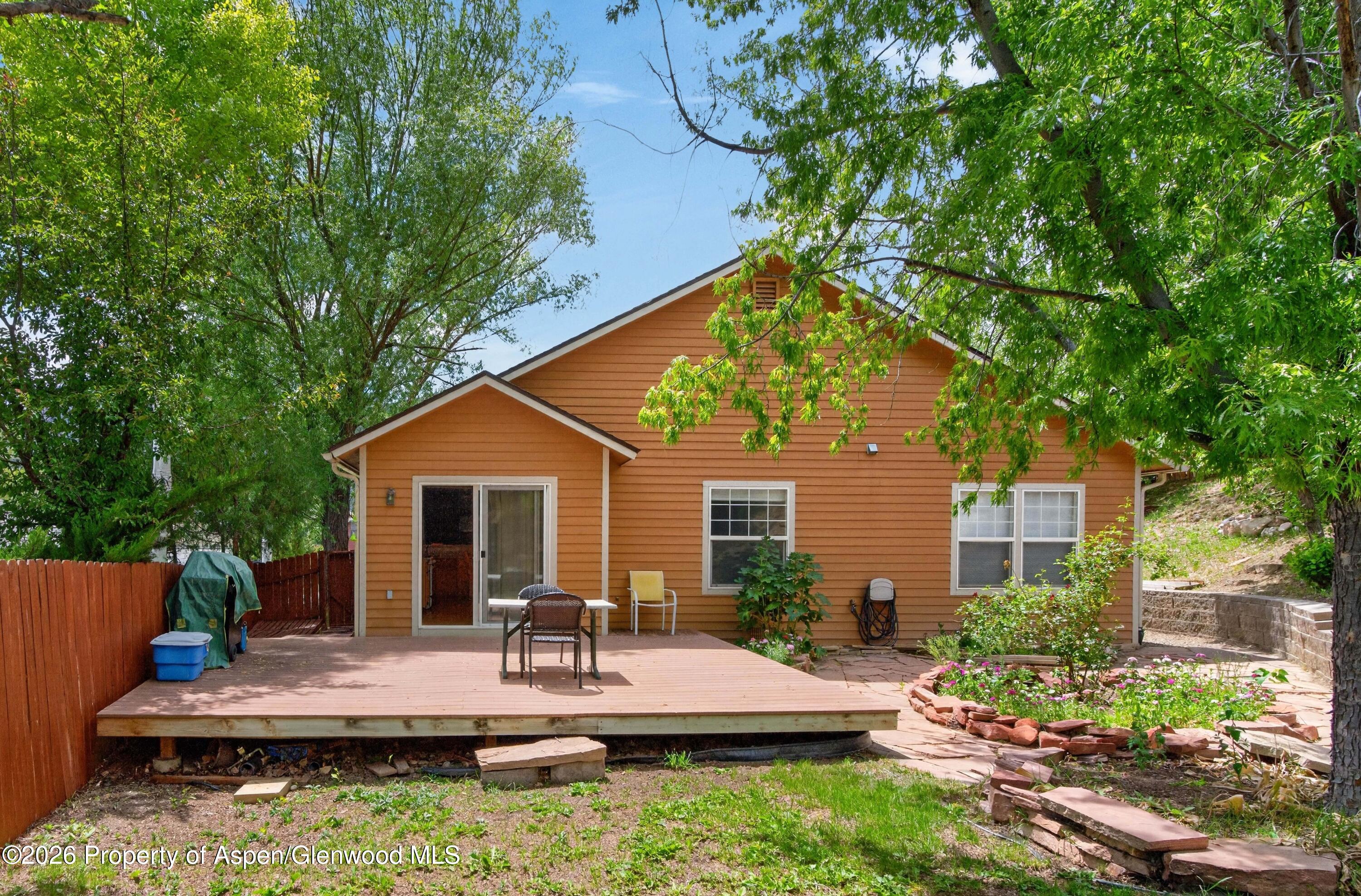 608 Lariat Loop New Castle, CO 81647 - Photo 31 of 32 a view of house with backyard and outdoor seating