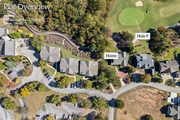an aerial view of a residential apartment building with yard and swimming pool