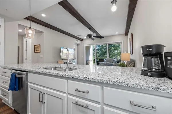 a view of a storage and utility room with washer and dryer