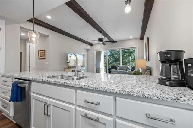 a view of a storage and utility room with washer and dryer