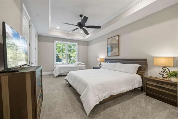 a bedroom with a bed and a lamp on table