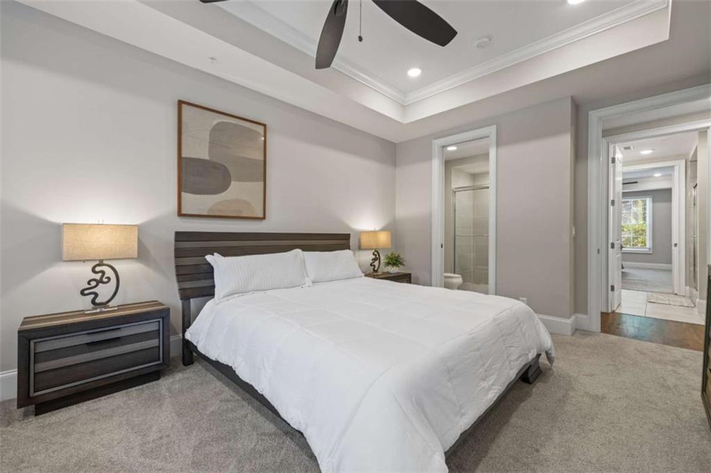 15 Cottage Lane, Unit 102 Toccoa, GA 30577 - Photo 30 of 40 a bedroom with a bed and a lamp on table