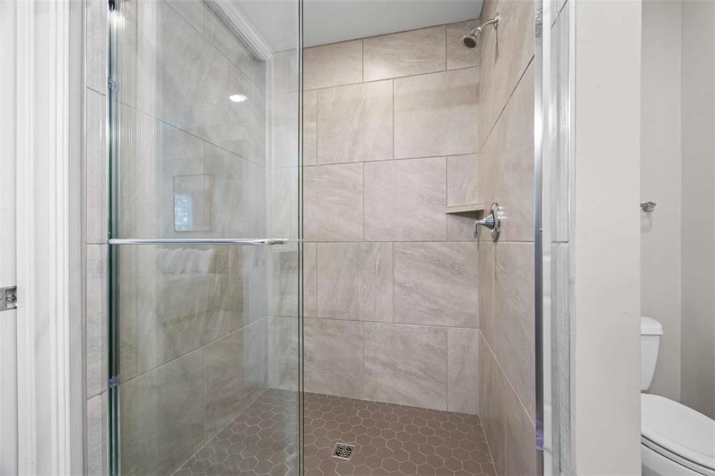 15 Cottage Lane, Unit 102 Toccoa, GA 30577 - Photo 36 of 40 a bathroom with a glass shower door
