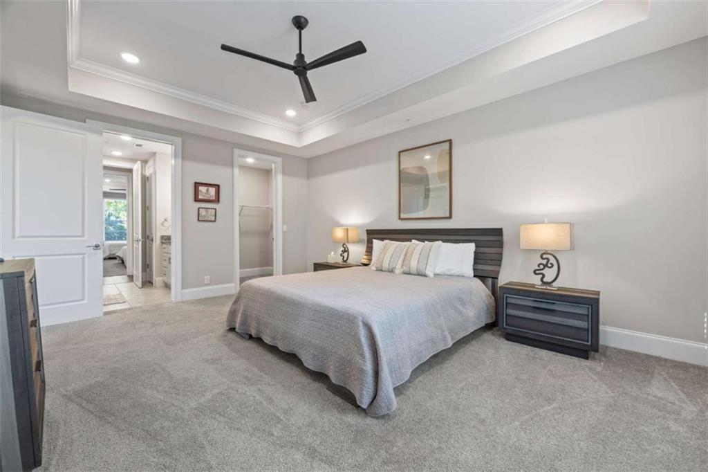 15 Cottage Lane, Unit 102 Toccoa, GA 30577 - Photo 38 of 40 a spacious bedroom with a bed and a lamp