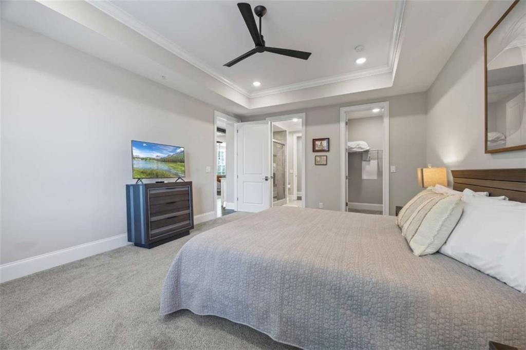 15 Cottage Lane, Unit 102 Toccoa, GA 30577 - Photo 39 of 40 a spacious bedroom with a bed and a flat screen tv