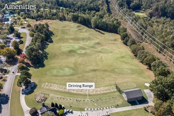 an aerial view of a house with a yard basket ball court and outdoor seating