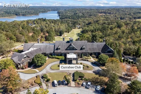 a aerial view of a house with balcony and trees