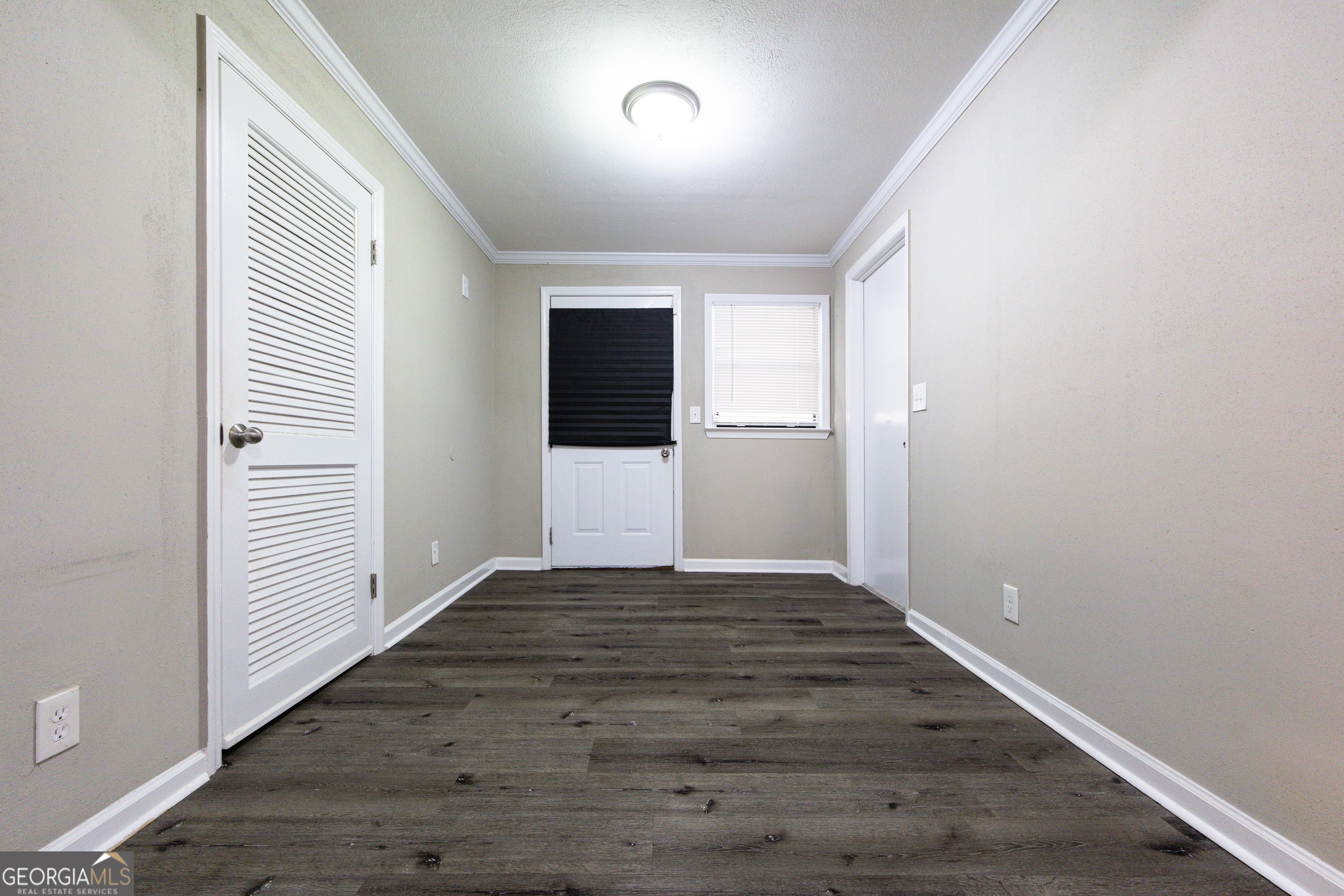 3 Primrose Court Columbus, GA 31907 - Photo 12 of 25 a view of an empty room with wooden floor and a window