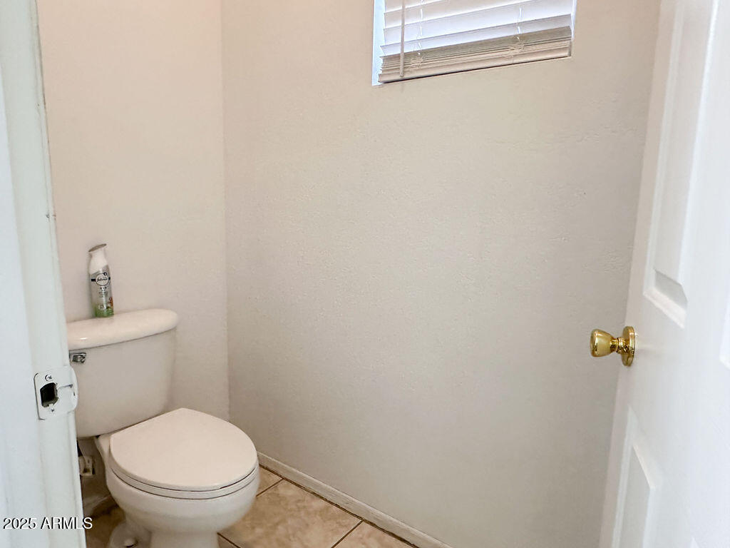 15220 Padres Road Arizona City, AZ 85123 - Photo 12 of 16 a white toilet sitting next to a shower