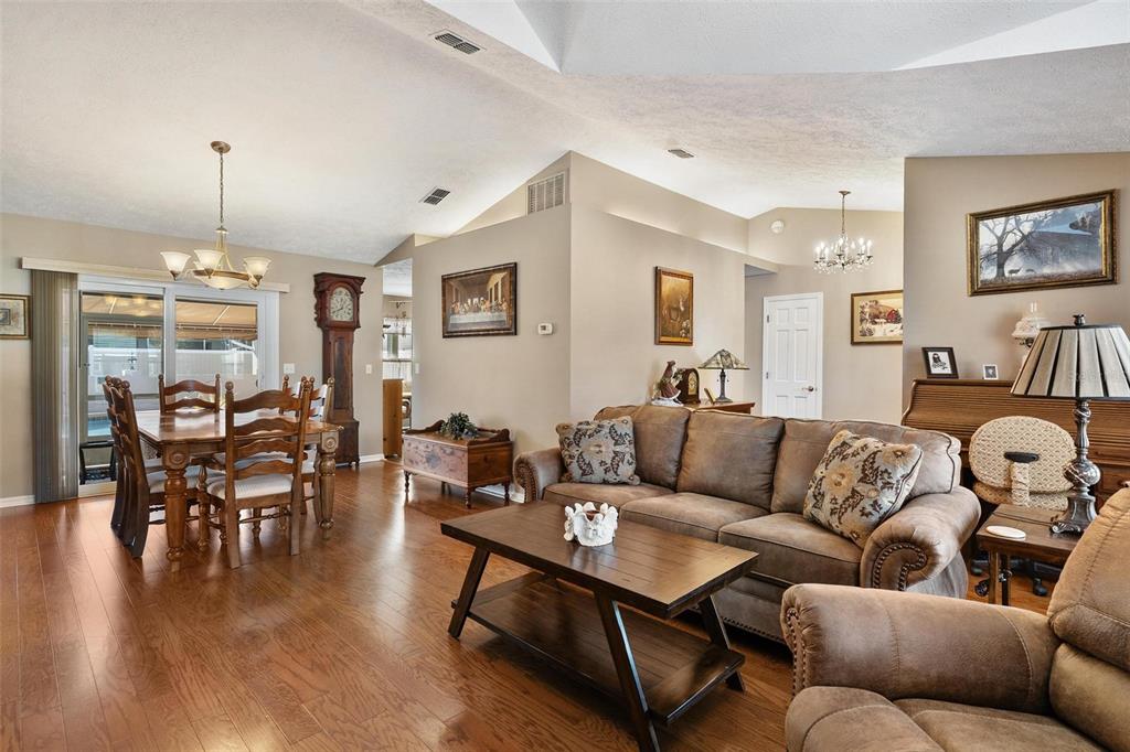 450 Northeast 55th Street Ocala, FL 34479 - Photo 11 of 68 a living room with furniture and wooden floor