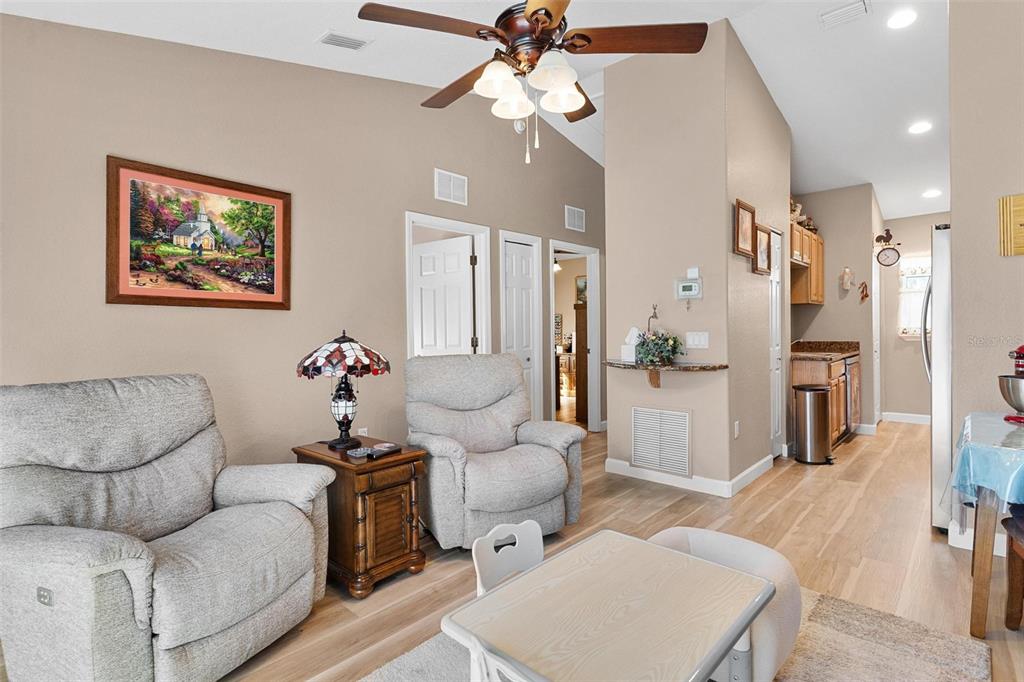 450 Northeast 55th Street Ocala, FL 34479 - Photo 46 of 68 a living room with furniture and a chandelier