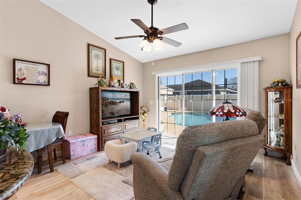 450 Northeast 55th Street Ocala, FL 34479 - Photo 48 of 68 a living room with furniture and a flat screen tv