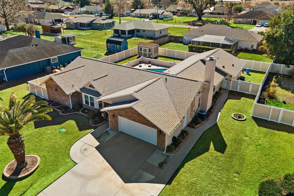450 Northeast 55th Street Ocala, FL 34479 - Photo 62 of 68 an aerial view of a house with swimming pool big yard and mountain view