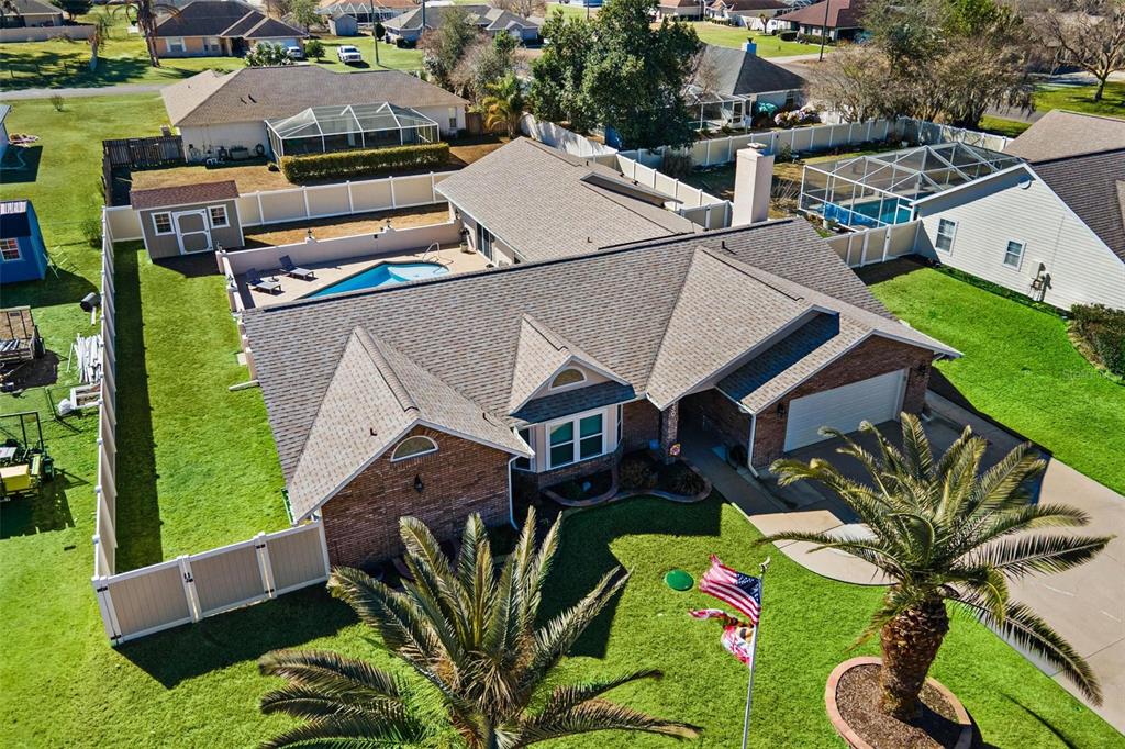 450 Northeast 55th Street Ocala, FL 34479 - Photo 64 of 68 an aerial view of a house with garden space and lake view