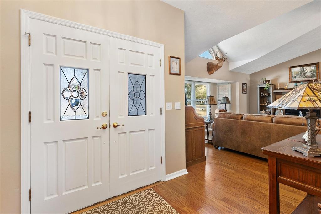 450 Northeast 55th Street Ocala, FL 34479 - Photo 7 of 68 a living room with furniture and a wooden floor